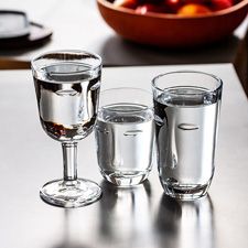 Clear wine glasses and tumblers with faces