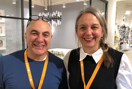 Two reps smiling