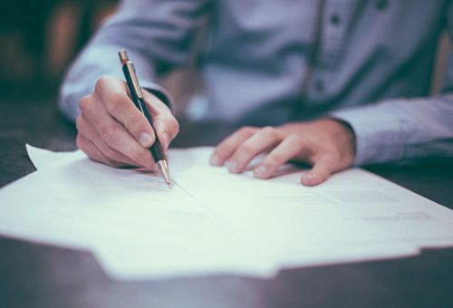 Person filling out a form