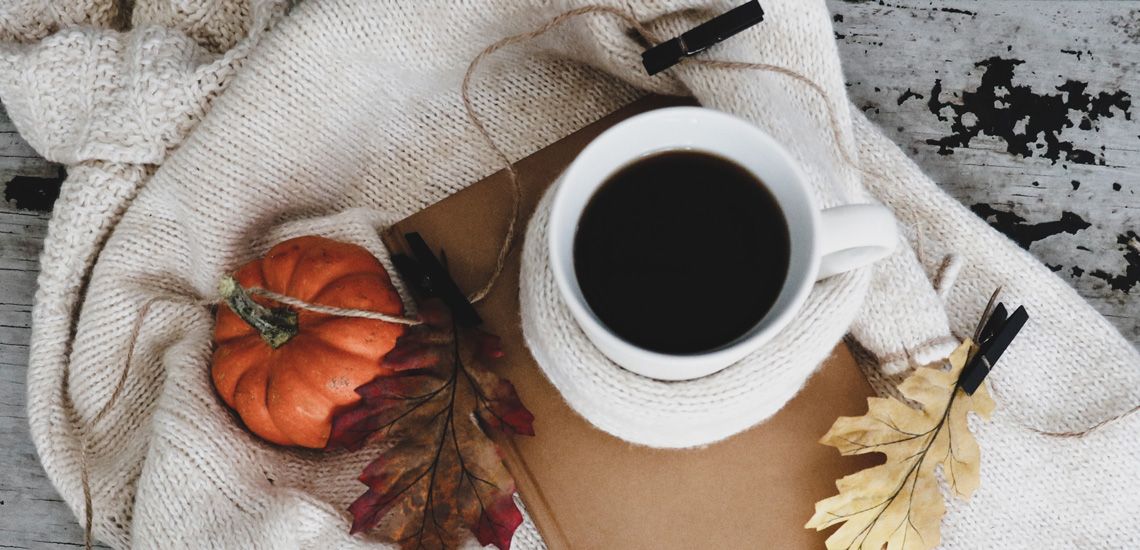 pumpkin with coffee on table