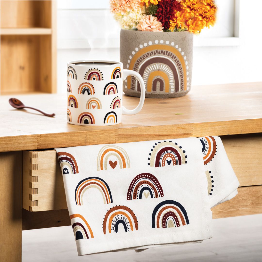 Bring a fun, folk-art vibe to your shop with our Boho collection! Featuring a New Mexico style of rustic rainbow, these pieces are available as a mug, kitchen towel, pin dish, planters and more. 🌈🌈🤎🧡💛⁠