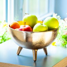 Golden bowl with apples