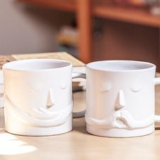 two mugs with faces
