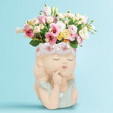 Girl with flowers vase