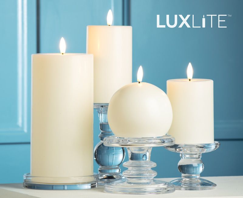 LUXLITE candles on a table