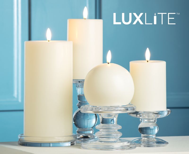 LUXLITE candles on a table