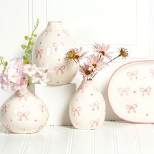 Pink and white plates and vases