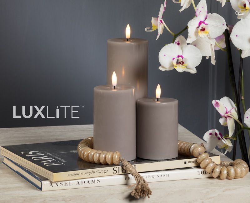 LUXLITE candles on a table