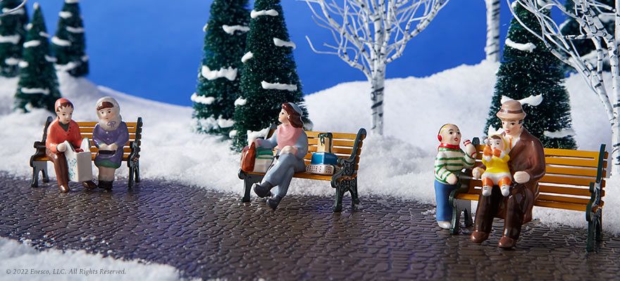 Village figurines on benches