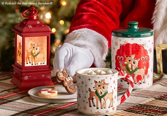 Santa's hand with cookie and mugs