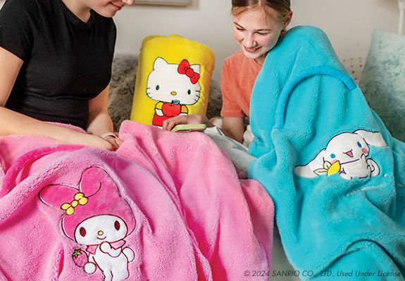 kids with sanrio blankets