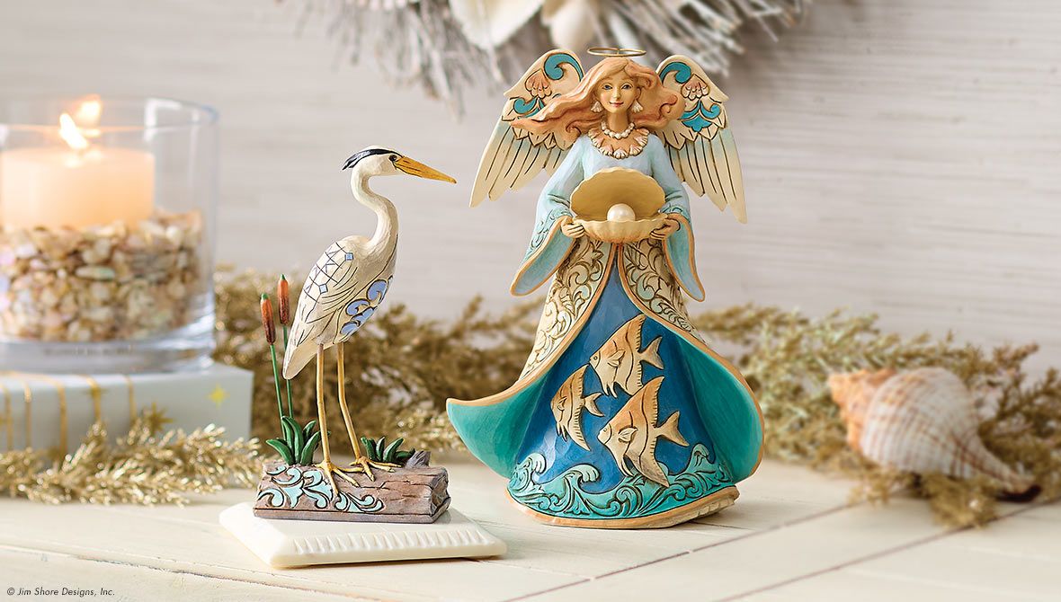 bird and angel figurine