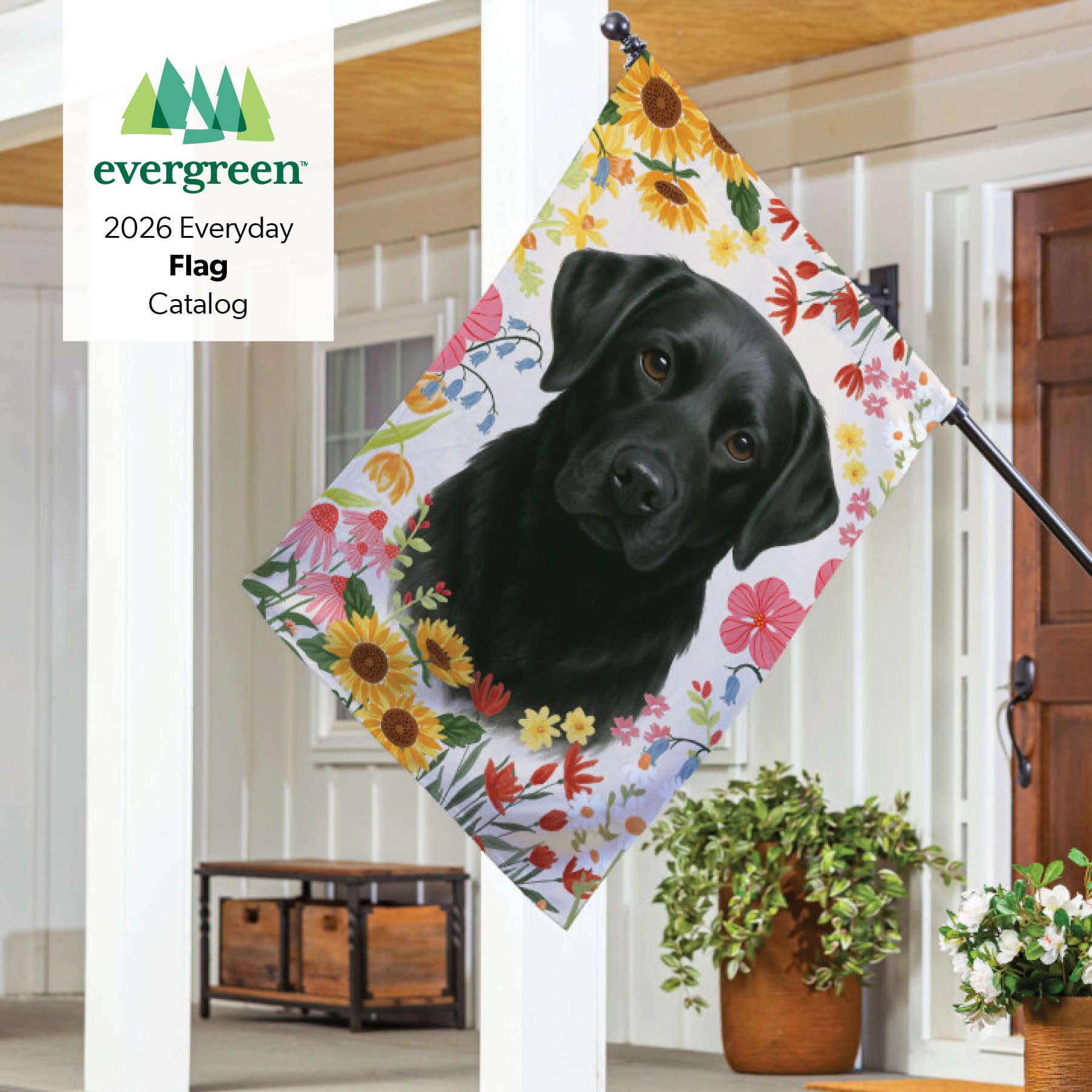 Evergreen 2026 Everyday Flag Catalog – black Labrador garden flag with colorful wildflower and sunflower border on a front porch