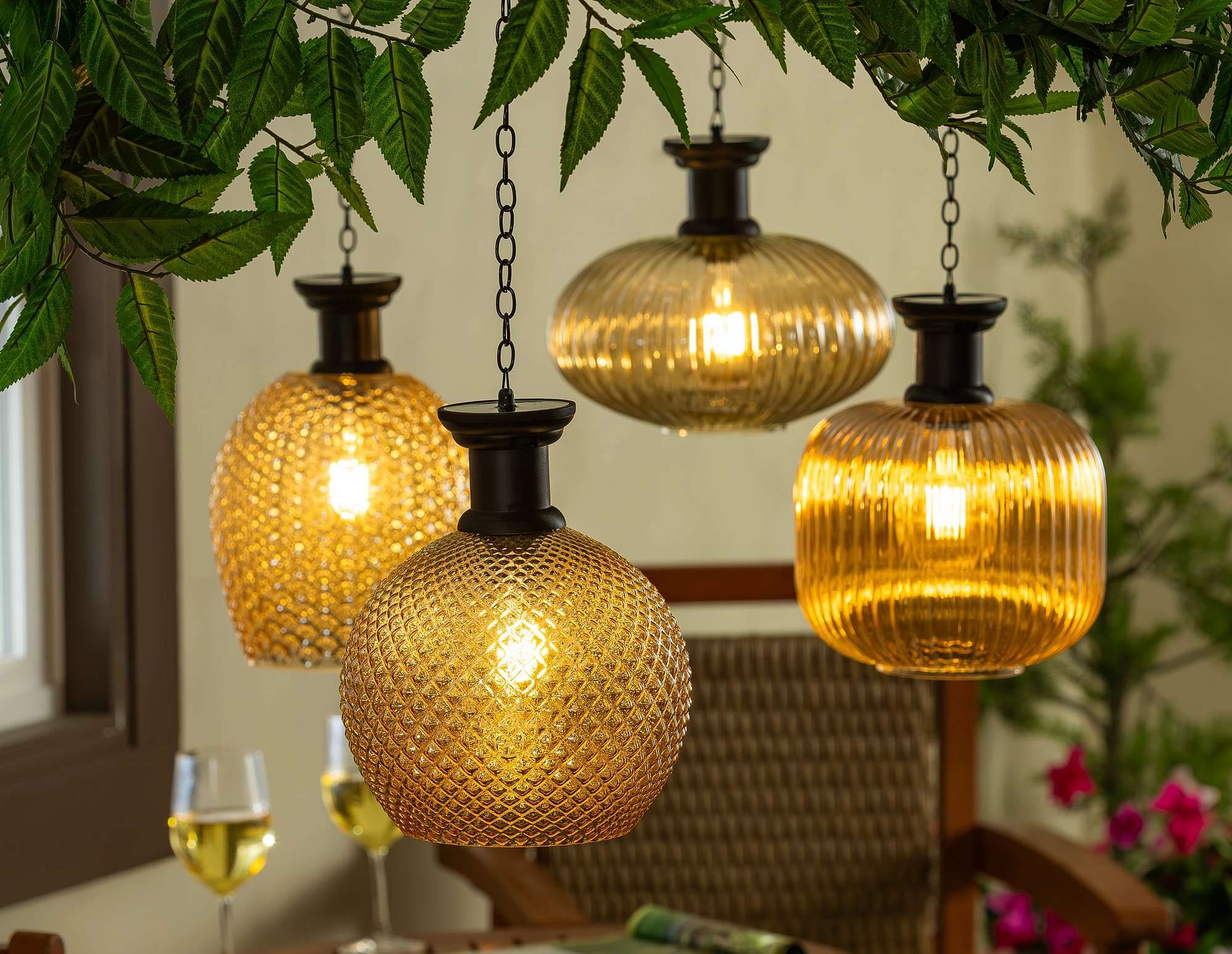 Garden Edge image featuring hanging lightly lit lamps