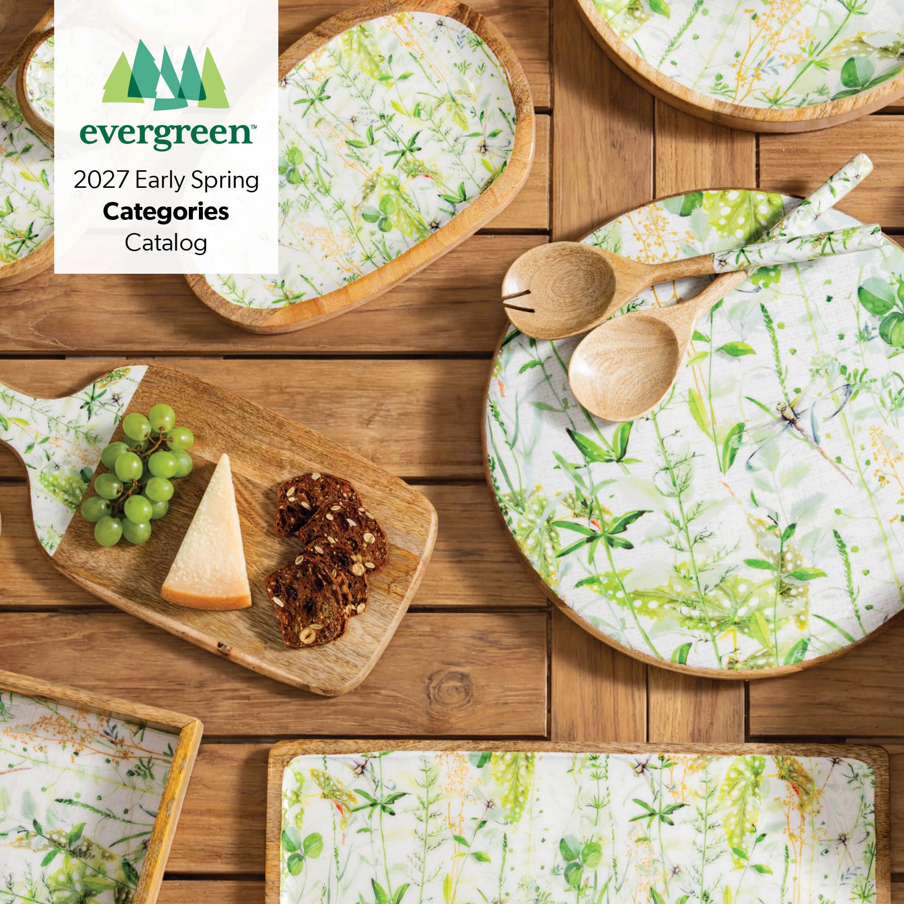 Evergreen 2027 Early Spring Categories Catalog – botanical-print mango wood serveware and plates on a wooden table