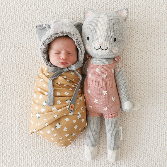 Baby and Knitted Doll